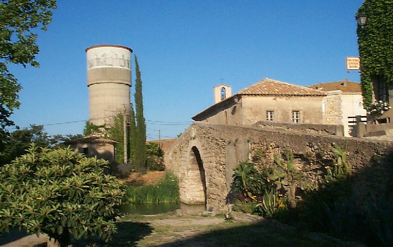 The centre of Le Somail. The water tower, bridge & chapel (behind the bridge) alongside the Midi Canal